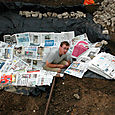 Lining pond with papers