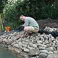 Chris edging pond with concrete