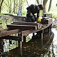 Stuart Cox installaing Trap Grounds boardwalk 