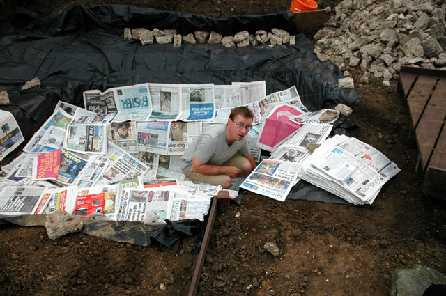 Lining pond with papers