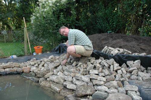 Chris edging pond with concrete