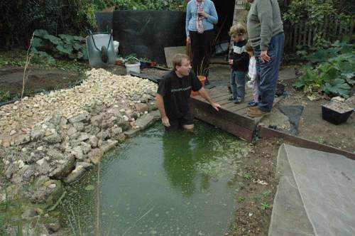 Chris getting cold in the pond