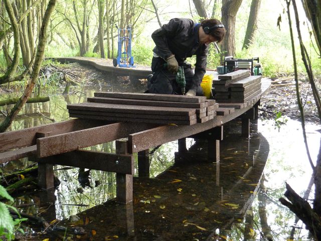 Stuart Cox installaing Trap Grounds boardwalk 